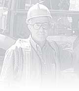 A graphic of a worker near his truck.